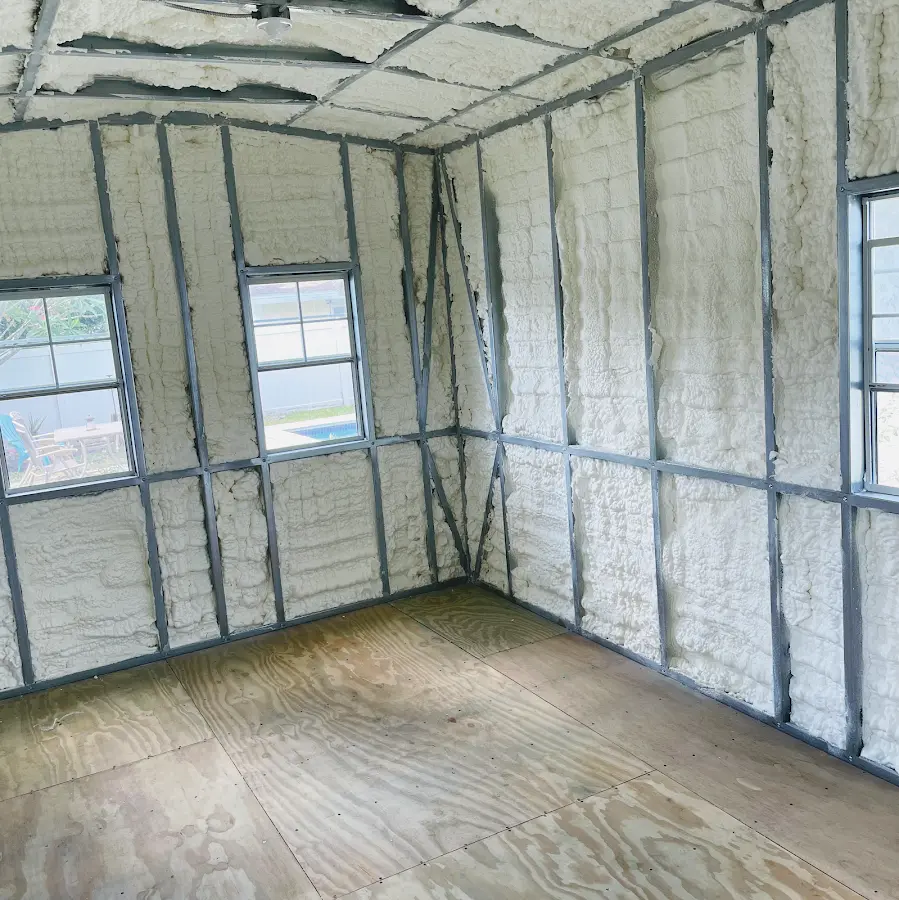 Closed-cell spray foam insulation applied to wall cavities in a residential project in Pembroke Pines